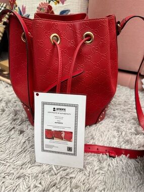 Gucci Red GG-Embossed Drawstring Bucket Crossbody